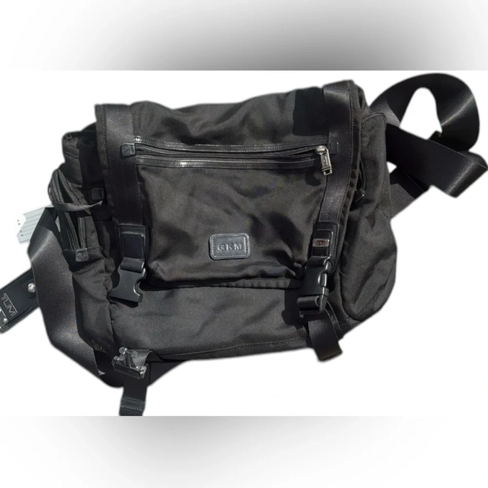 TUMI MESSENGER BAG.